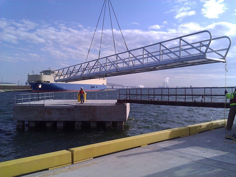 aluminum gangways go between a set of dolphins