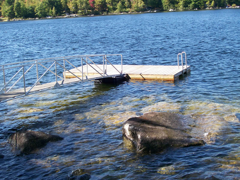 The aluminum gangway is attached to an 8' x 16' float