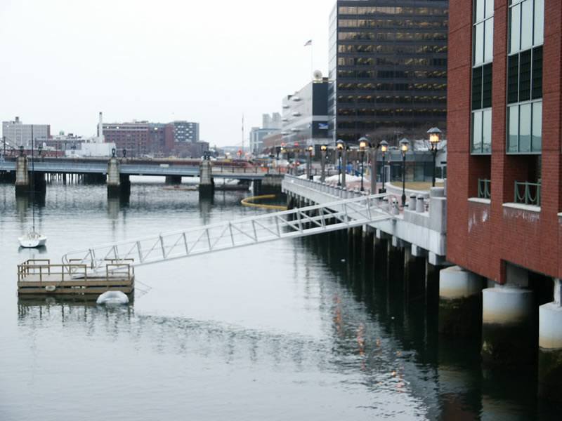 The primary function of this gangway is to transport hotel guests to and from Logan Airport. 